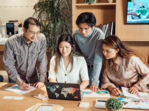 Group of IT professionals collaborating in a modern office meeting