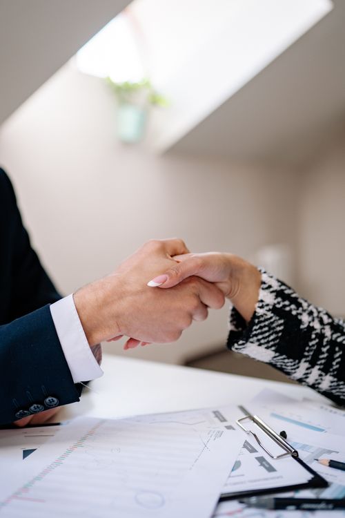 Close-up of a professional handshake finalizing a job offer agreement