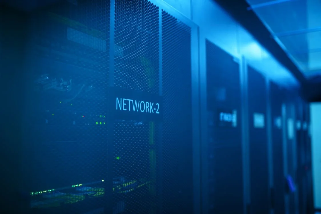 Modern server room with illuminated network equipment representing a cloud engineering career path